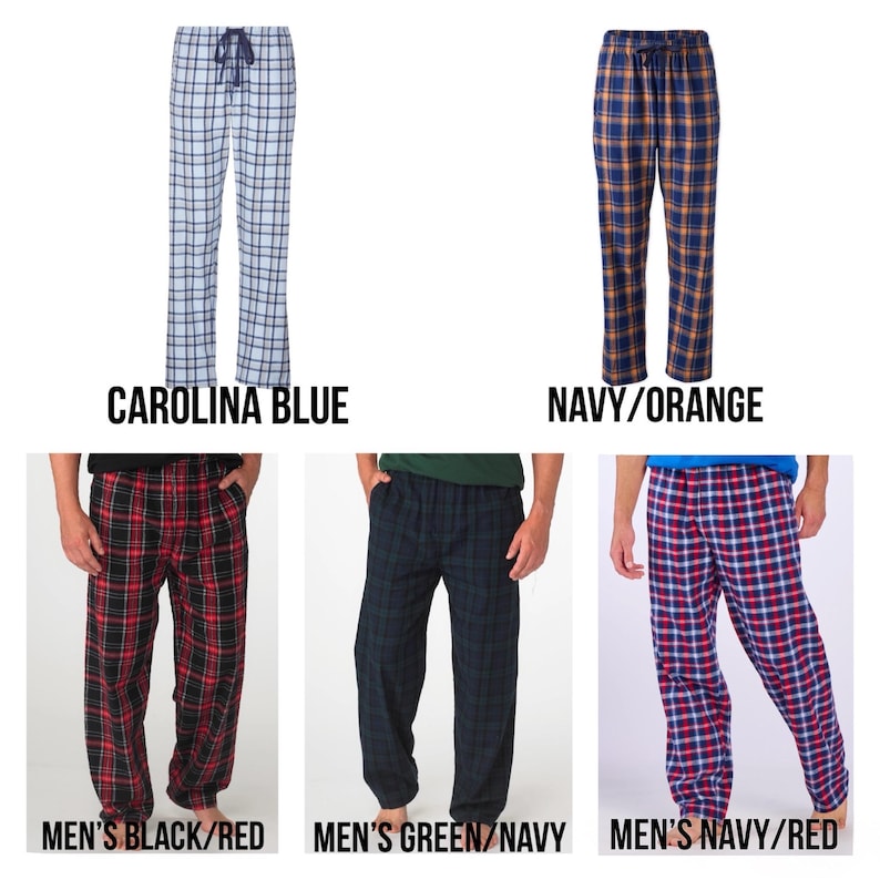 May include: Selection of plaid pajama trousers in multiple colours. The options are Carolina blue, navy and orange, black and red, green and navy, and navy and red. Each pair has a drawstring waist.
