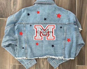 May include: A blue denim jacket with red and black stars and a gray letter M patch that says "Your Custom Logo".