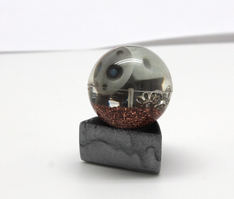 1.1 inch sphere with copper and metal bits it is chewing on Aron Steel Pokemon Gen 3 Marble Desktop Display Piece PoGo Evolves to Aggron