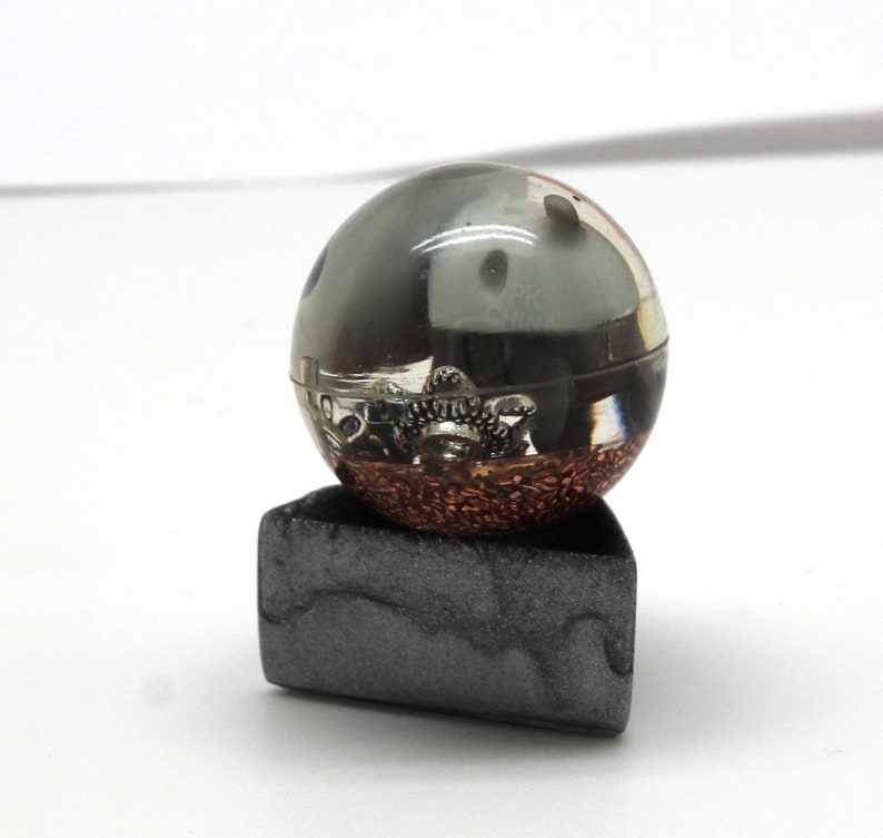 1.1 inch sphere with copper and metal bits it is chewing on Aron Steel Pokemon Gen 3 Marble Desktop Display Piece PoGo Evolves to Aggron