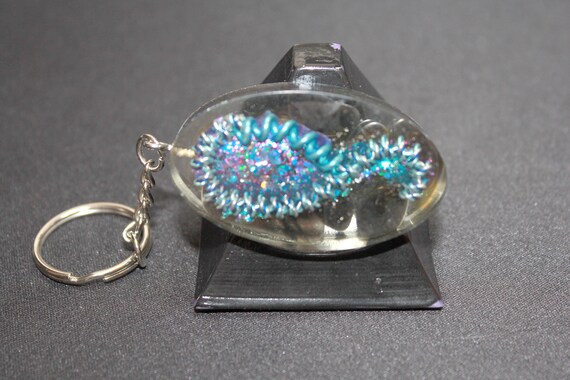 EMF Blocker Keychain Pocket Electrical Blocker 2 inch Blue and Silver Coils with Funky Glitter Bomb over Volcanic Glass Obsidian