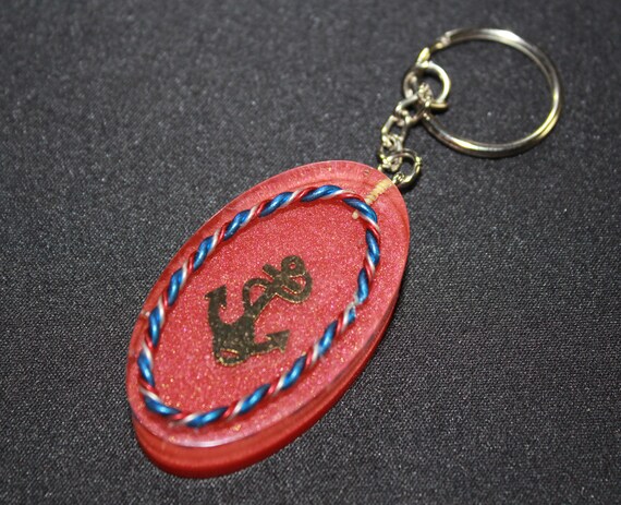 Anchor with Red White and Blue Twisted Wire on Red Background - Spectrum Harmonizer Made for You