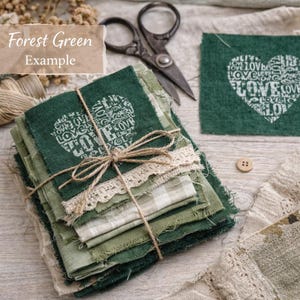 May include: A stack of forest green fabric squares tied with twine and lace, featuring a heart design with the word "LOVE" repeated. The image includes a pair of scissors and the text "Forest Green Example".