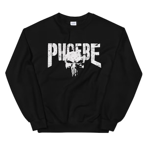 May include: Black sweatshirt with a white distressed graphic of a skull and the word "PIGCERE" printed on the front.