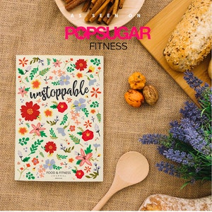 Pode incluir: Um diário com padrão floral com o texto "unstoppable" em letras pretas. O diário é intitulado "Food & Fitness Journal".