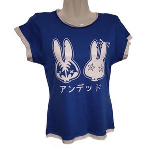 May include: A blue t-shirt with white bunny rabbit graphics and the text "アンデッド" in Japanese.