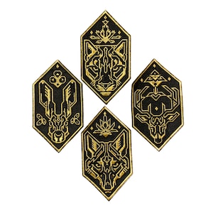 May include: Four black and gold embroidered patches featuring geometric animal designs. The patches are shaped like hexagons and feature a wolf, a deer, a cougar, and a rabbit.
