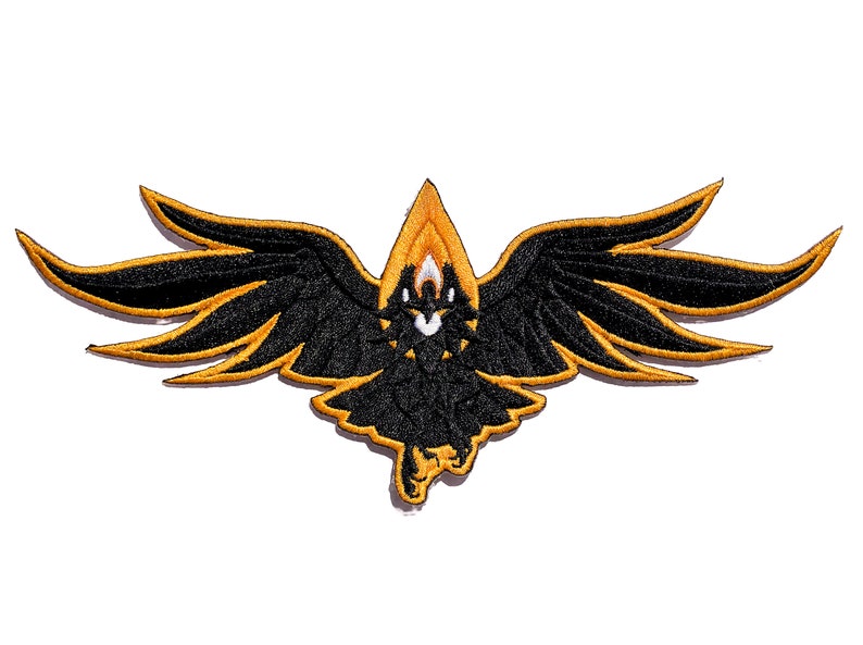 May include: Black embroidered patch of a bird with outstretched wings. The wings are outlined in gold and the bird has a white eye.