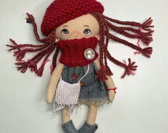 Textile art doll with pigtails in red beret