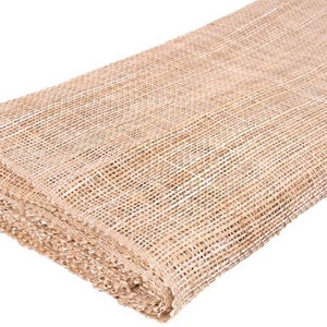 May include: A roll of natural brown burlap fabric with a woven mesh texture.