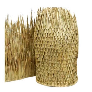May include: A close-up of a woven natural fiber thatch mat. The mat is made of long, thin strands of straw that are woven together in a tight, intricate pattern. The mat is a light brown color and has a slightly rough texture.