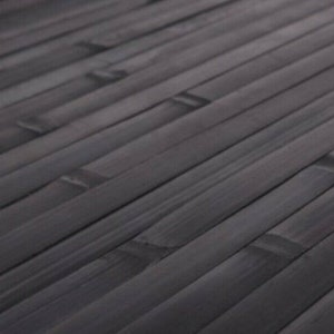 May include: Close-up of a dark gray bamboo mat. The bamboo strips are arranged diagonally, creating a textured surface. The mat's color is a deep, neutral gray, suitable for various interior design styles.