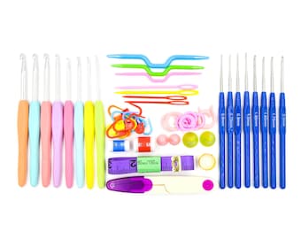 May include: A comprehensive crochet kit featuring a range of tools. Includes pastel and blue crochet hooks, stitch markers, yarn needles, a measuring tape, and other accessories. The kit is arranged on a white background.