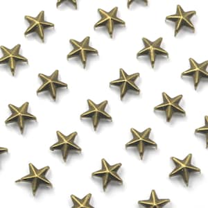May include: A collection of 20 gold-toned metal star-shaped studs. The studs have a flat back and a pointed top. They are ideal for adding a touch of sparkle to your crafts.