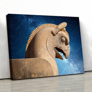 May include: A canvas print featuring a stone sculpture of a mythical creature with a bird-like head and a horse-like body. The sculpture is a light brown color, set against a dark blue starry sky.