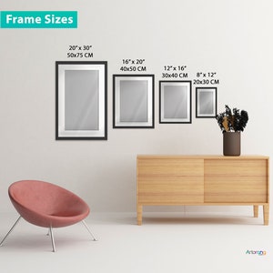 May include: Four black picture frames of different sizes hanging on a white wall. The frames are empty and have a white mat. The frame sizes are 20x30 inches, 16x20 inches, 12x16 inches, and 8x12 inches. The frames are displayed on a white wall with a light wood dresser and a pink chair in the foreground.