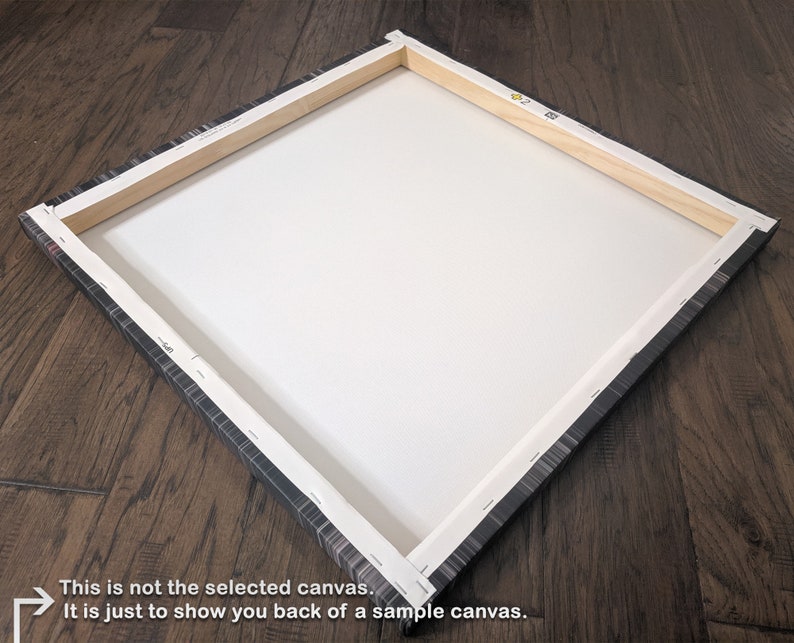 May include: The back of a stretched canvas with a wooden frame. The canvas is wrapped around the frame and stapled in place. The frame is made of natural wood.