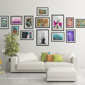 May include: A white couch with pillows in front of a white wall with black framed artwork featuring calligraphy and abstract designs. The text "Order 3+ to get 10% EXTRA Discount" is visible below the artwork.