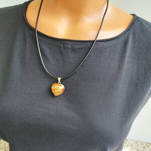 Leather cord pendant necklace with brown banded agate heart