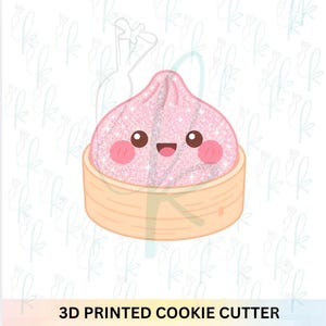 May include: A 3D printed cookie cutter featuring a pink glittery dumpling character with a smiling face, dark eyes, and rosy cheeks, sitting inside a light tan bamboo steamer basket. The text 3D PRINTED COOKIE CUTTER is at the bottom.