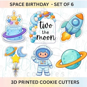 May include: A set of six space-themed cookie cutters featuring a cake with stars, an arch with the text 'two the moon', a rocket ship, a balloon cluster with a moon and star, an astronaut, and a planet with rings. Text reads SPACE BIRTHDAY - SET OF 6.