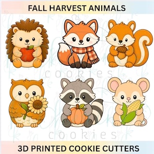 May include: A set of six 3D printed cookie cutters featuring cartoon animals with the text FALL HARVEST ANIMALS and 3D PRINTED COOKIE CUTTERS. The animals include a hedgehog with an apple, a fox with a scarf, a squirrel with an acorn, an owl with a sunflower, a raccoon with a pumpkin, and a mouse with corn.