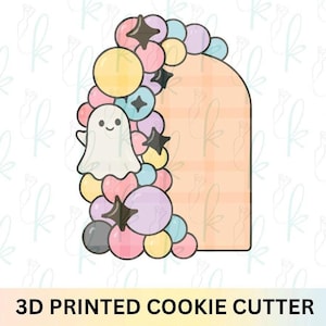 May include: A 3D printed cookie cutter in the shape of an arch, decorated with a cluster of colorful balloons, stars, and a cute ghost. The text "3D PRINTED COOKIE CUTTER" is at the bottom.