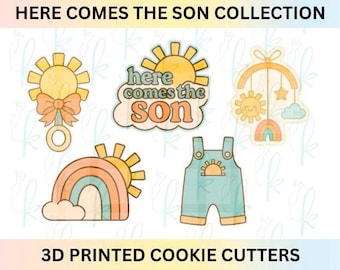 May include: A set of five 3D printed cookie cutters featuring a sun rattle with a bow, a sun with the text here comes the son, a mobile with a sun, star, cloud and rainbow, a rainbow with a sun, and overalls with a sun graphic in muted colors.