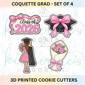 May include: Set of four 3D printed cookie cutters with a graduation theme. Designs include a bow with "class of 2026", a graduation cap with a pink bow, a graduate holding flowers, and a bouquet of pink roses.