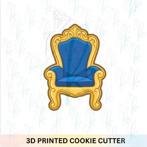 May include: A 3D printed cookie cutter shaped like a royal throne. The chair has a blue seat and back with gold trim and details. The text "3D PRINTED COOKIE CUTTER" is at the bottom.
