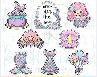 May include: A set of 8 3D printed cookie cutters with a mermaid birthday theme. The shapes include a cake with a mermaid tail, an arch with the text one-der the sea, a mermaid, a seashell crown, a clam with the number 1, two mermaid tails, and balloons.