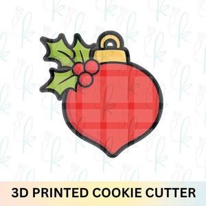 Cortador de galletas con adorno de acebo