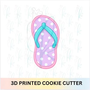 May include: A 3D printed cookie cutter in the shape of a flip-flop. The flip-flop has a pink border, a lavender base with white polka dots, and a turquoise strap. The text "3D PRINTED COOKIE CUTTER" is at the bottom.