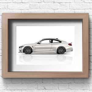 May include: A white coupe car with black wheels and a black interior is shown in profile against a white background. The car is framed in a light wood frame.