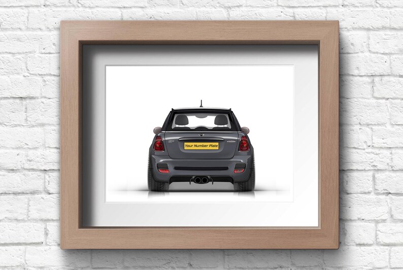 May include: A gray Mini Cooper car with a yellow license plate that says "Your Number Plate" is shown from the rear. The car is parked on a white surface.