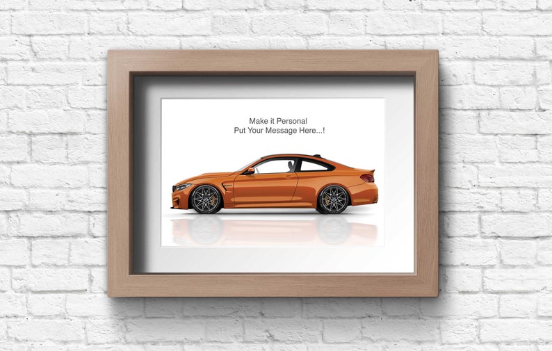 May include: A framed print of an orange BMW M4 with a white background. The text "Make it Personal Put Your Message Here..." is at the top of the print.