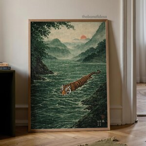 May include: A framed art print shows a tiger swimming in a river, with mountains in the background. The artwork is in a traditional Japanese style, using greens, browns, and oranges. The text "thebonafidesa" is in the upper right corner of the print.