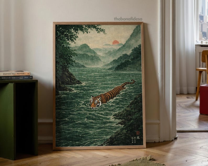 May include: A framed art print shows a tiger swimming in a river, with mountains in the background. The artwork is in a traditional Japanese style, using greens, browns, and oranges. The text "thebonafidesa" is in the upper right corner of the print.