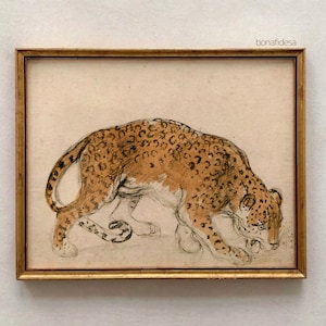 May include: A framed drawing of a brown and black leopard with a light brown background. The leopard is drawn in a realistic style and is shown in a crouching position.
