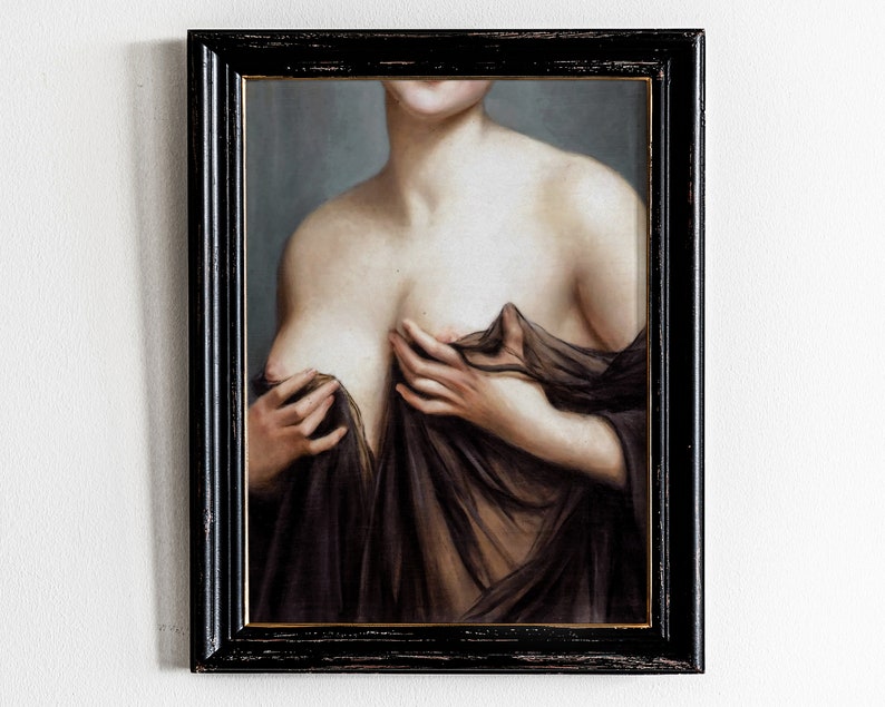 May include: A framed oil painting of a woman's torso, with her hands holding a sheer fabric draped over her chest. The painting is in a dark wood frame.