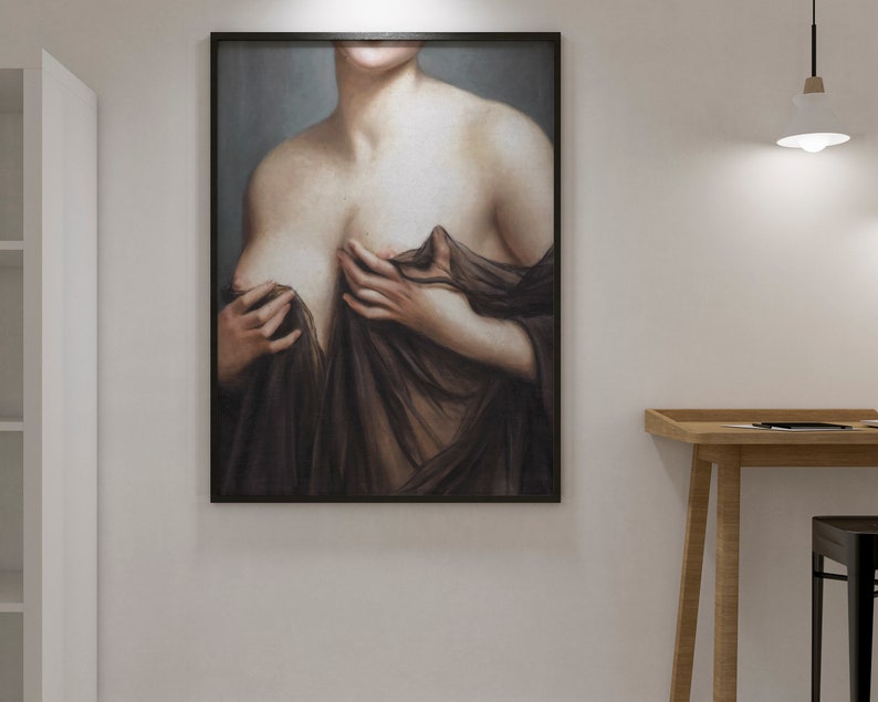 May include: A framed painting depicting a woman's torso, she is wearing a sheer black fabric draped over her shoulders. The painting is set against a light grey background.