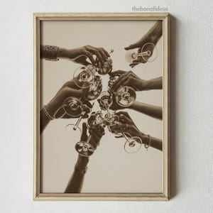May include: Sepia-toned framed print featuring multiple hands holding champagne glasses in a celebratory toast. The image captures a moment of togetherness, with the glasses raised in a circle. The print has a vintage aesthetic.