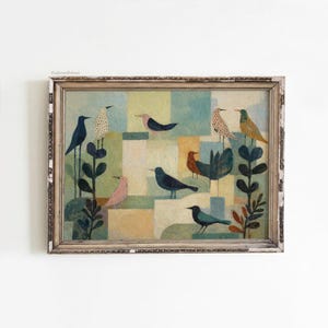 May include: A framed painting featuring stylized birds in various colors, including blue, pink, and orange, set against a geometric background of muted greens, blues, and yellows. The artwork has a vintage aesthetic.