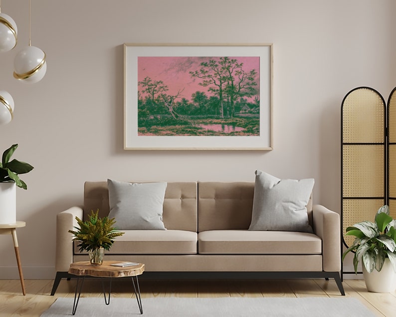 Puede incluir: Una impresi&oacute;n enmarcada de una pintura de paisaje con un cielo rosa y &aacute;rboles verdes reflejados en un cuerpo de agua tranquilo.