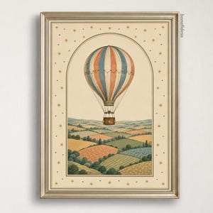 May include: A framed wall art print featuring a vertical illustration of a striped hot air balloon in blue, red, and cream floating above a rolling landscape of green and gold fields. The border includes small star icons and the text bonafidesa.
