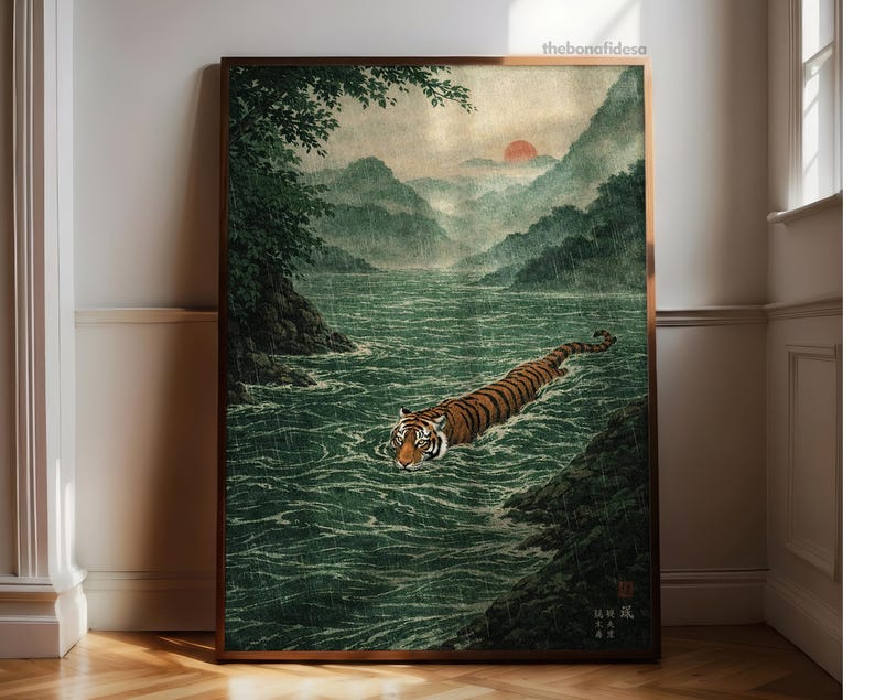 May include: Framed art print showing a tiger swimming in a river. The image features a tiger with orange and black stripes in a green river, with mountains and a red sun in the background. The style is reminiscent of traditional Japanese art.