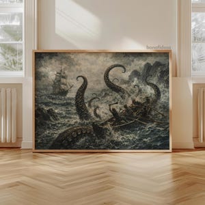 May include: A framed vintage illustration depicts a sea battle with a giant squid attacking a ship and a rowboat. The artwork is in shades of gray and white, with dramatic waves and tentacles. The image is set in a room with wood flooring and white trim.