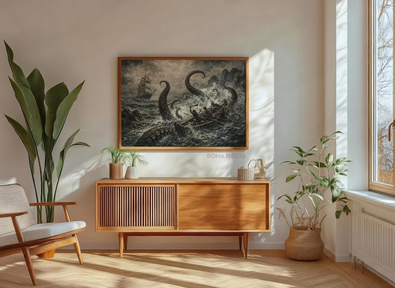 May include: A framed black and white nautical art print depicts a ship battling a giant sea creature. The artwork is displayed above a wooden cabinet with a mid-century modern design. The room is decorated with plants and a wooden chair.
