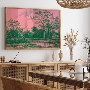 Puede incluir: Una impresi&oacute;n enmarcada de una pintura de paisaje con un esquema de color rosa y verde. La pintura representa una escena de bosque con un estanque en primer plano y &aacute;rboles en el fondo.