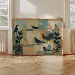 May include: A framed art print featuring a whimsical illustration of various birds. The birds are depicted in shades of blue, pink, orange, and yellow, set against a backdrop of geometric shapes in muted tones. The artwork is framed in a natural wood.